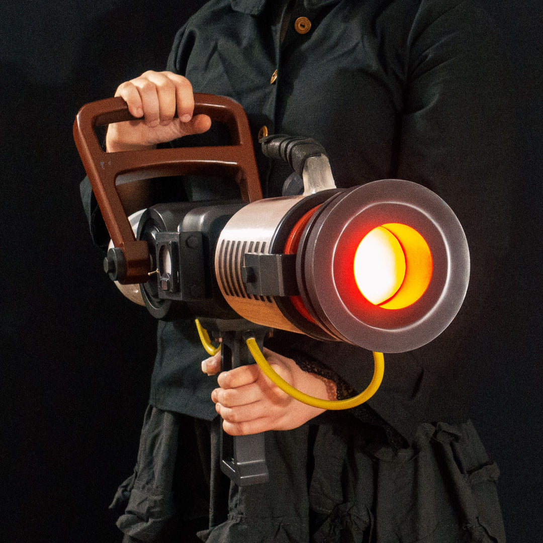 Arkan holding a Team Fortress 2 cosplay prop Quick Fix from Meet the Real Medic from the red team