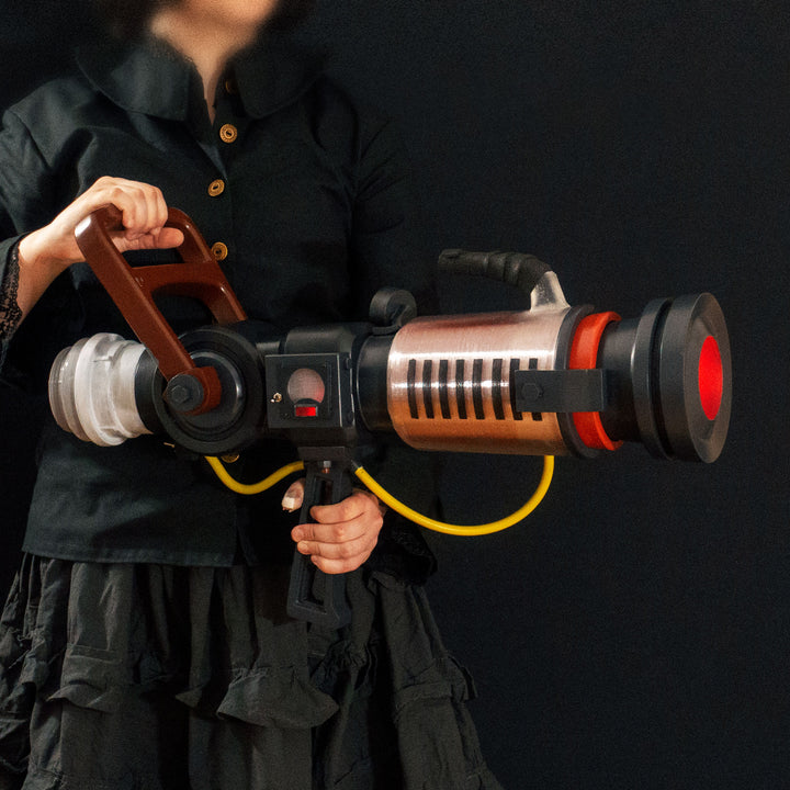 Arkan holding a Team Fortress 2 cosplay prop Quick Fix from Meet the Real Medic from the red team