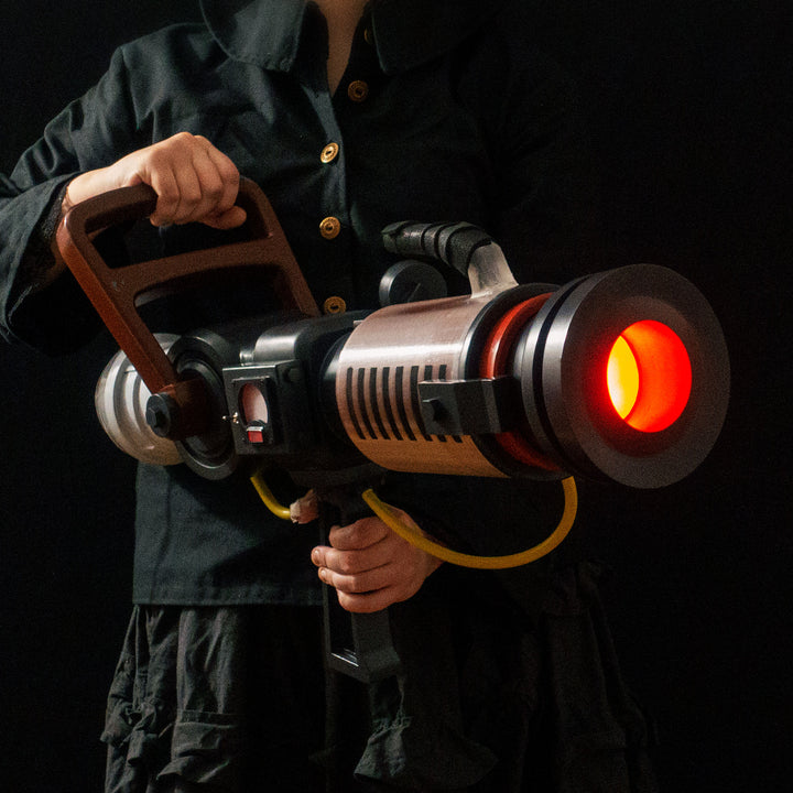 Arkan holding a Team Fortress 2 cosplay prop Quick Fix from Meet the Real Medic from the red team