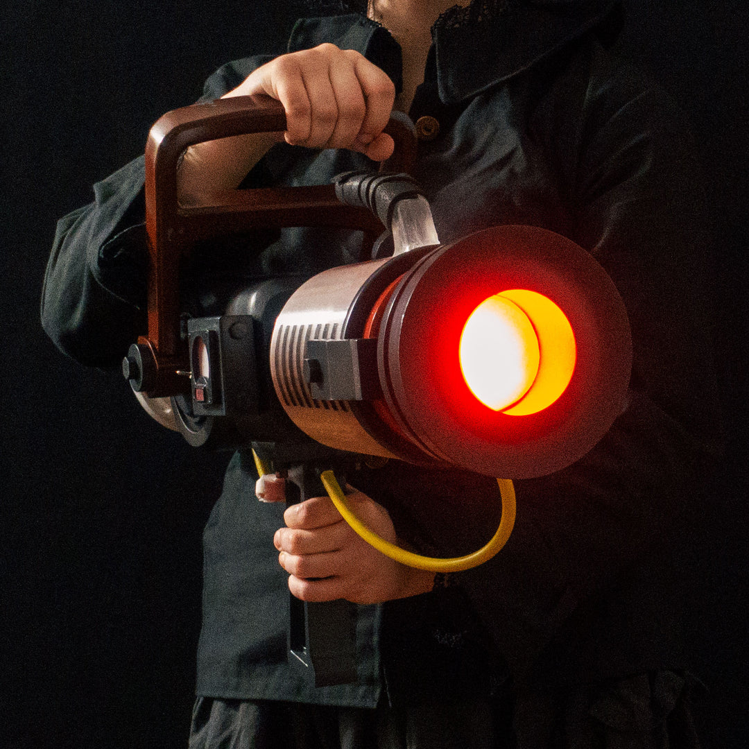 Arkan holding a Team Fortress 2 cosplay prop Quick Fix from Meet the Real Medic from the red team