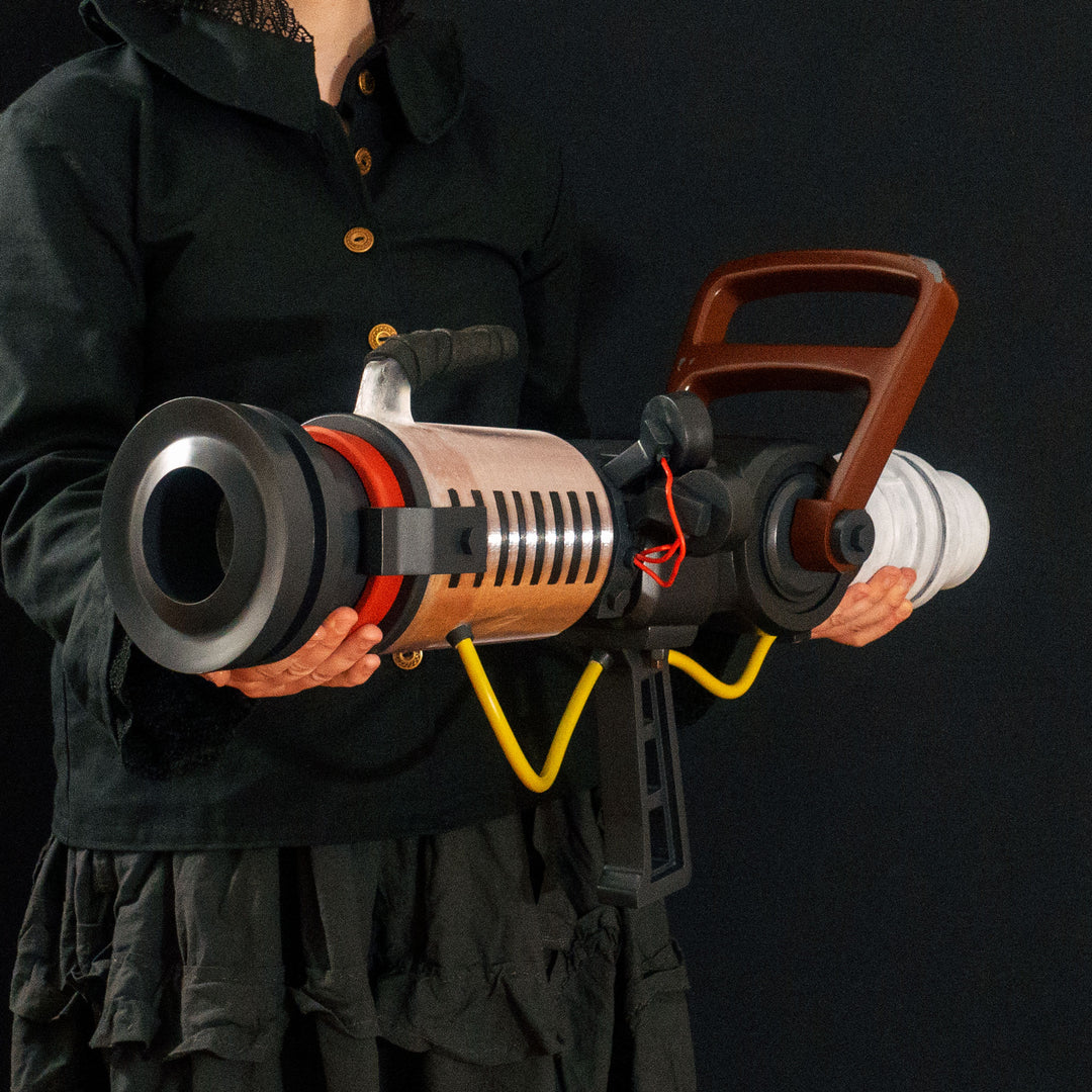 Arkan holding a Team Fortress 2 cosplay prop Quick Fix from Meet the Real Medic from the red team