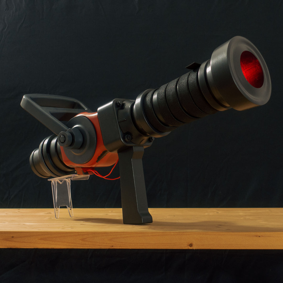 A TF2 Medic Medigun cosplay prop with 2 light modes for its glowing barrel! Has a powerful glow and can be either activated with the handle or without worry with I/O switches!