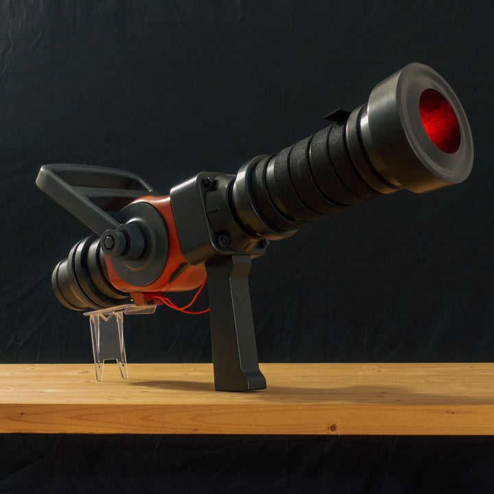 A TF2 Medic Medigun cosplay prop with 2 light modes for its glowing barrel! Has a powerful glow and can be either activated with the handle or without worry with I/O switches!