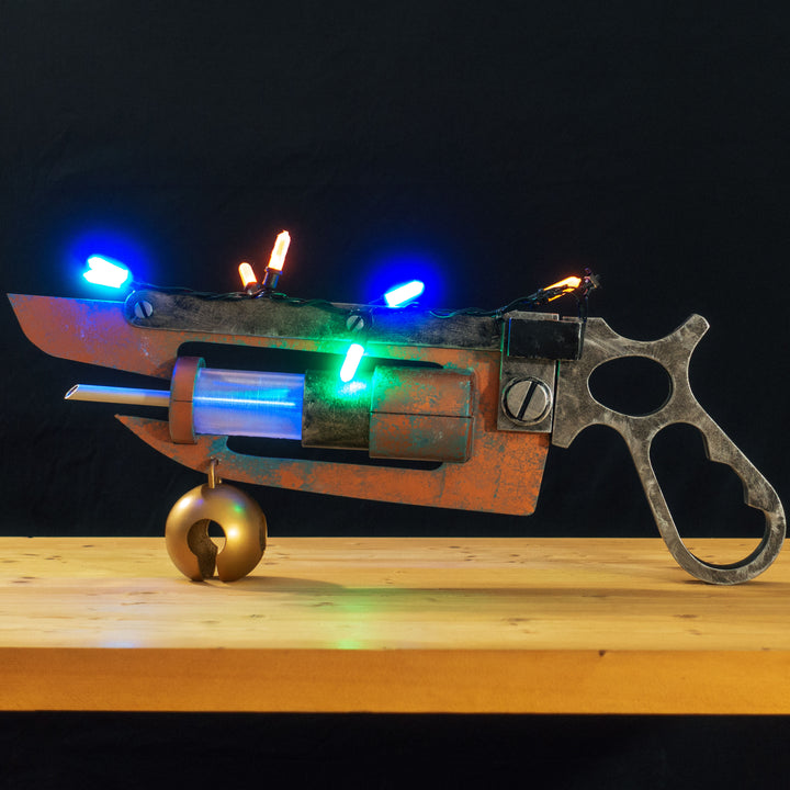 A TF2 Medic Übersaw prop with a metal paint job. Comes in Festive and with out without blood effects!