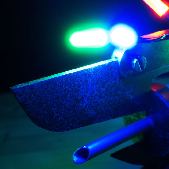 A TF2 Medic Übersaw prop with a metal paint job. Comes in Festive and with out without blood effects!