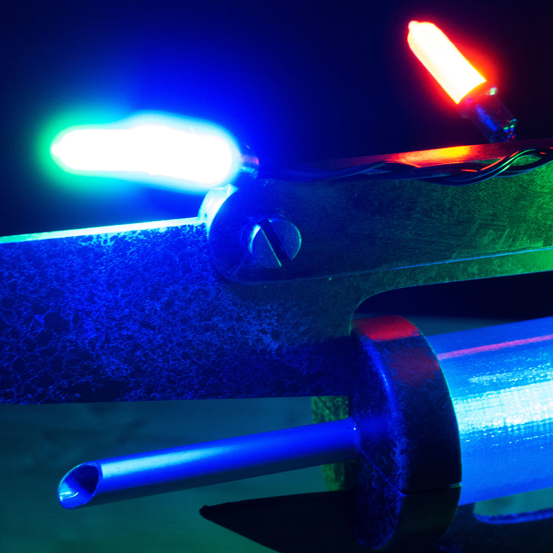 A TF2 Medic Übersaw prop with a metal paint job. Comes in Festive and with out without blood effects!