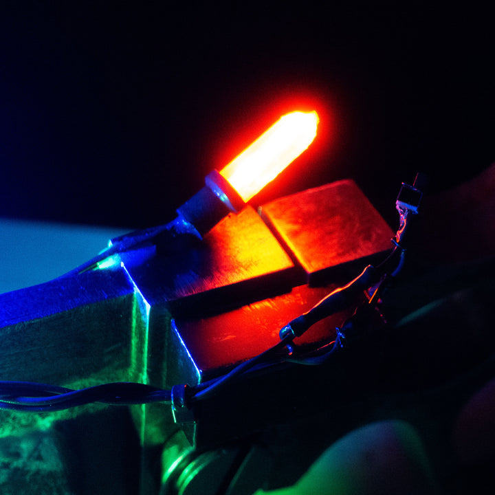 A TF2 Medic Übersaw prop with a metal paint job. Comes in Festive and with out without blood effects!