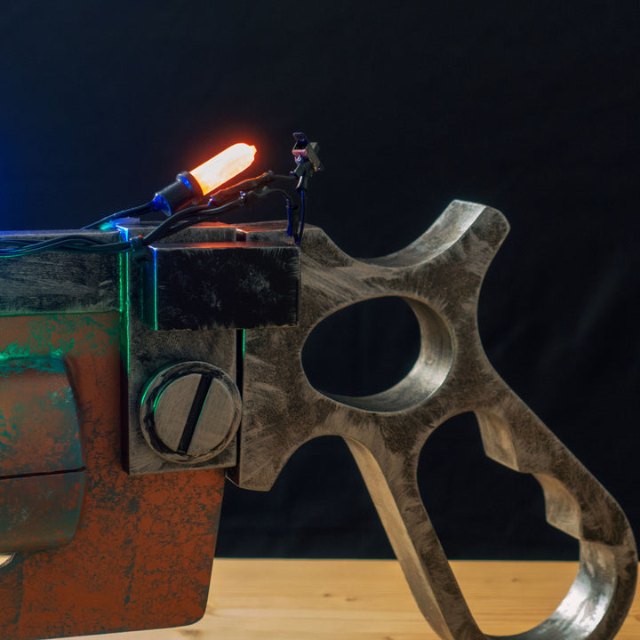 A TF2 Medic Übersaw prop with a metal paint job. Comes in Festive and with out without blood effects!