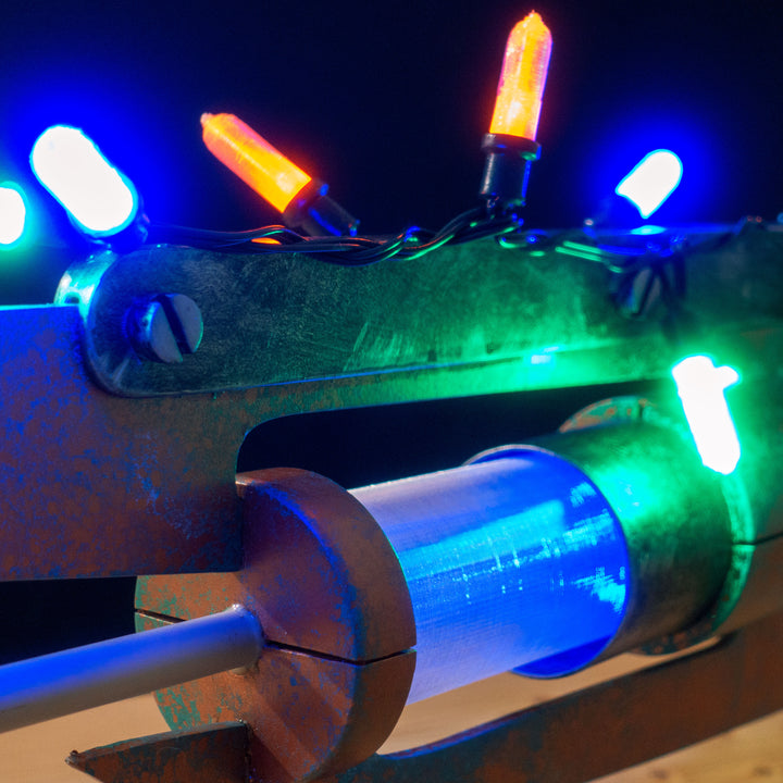 A TF2 Medic Übersaw prop with a metal paint job. Comes in Festive and with out without blood effects!