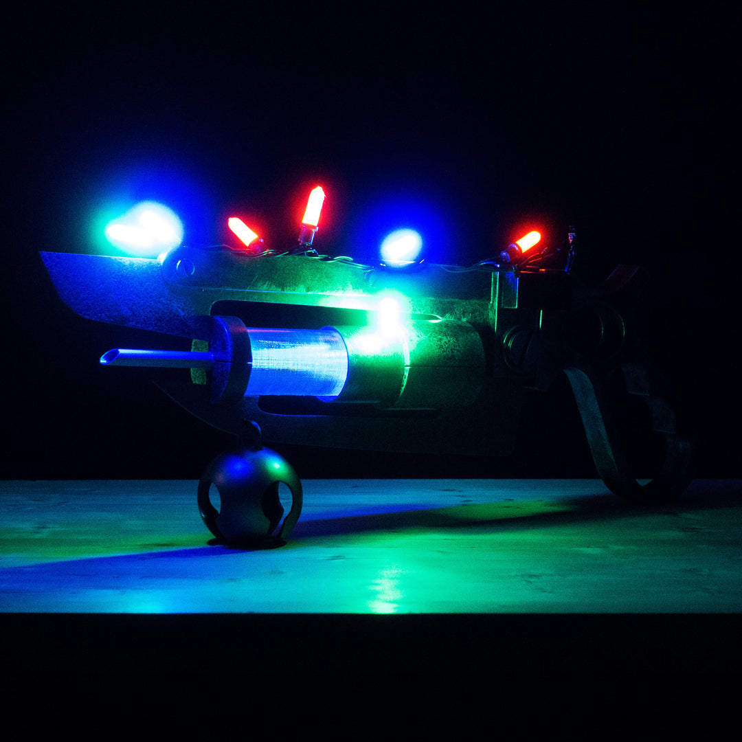 A TF2 Medic Übersaw prop with a metal paint job. Comes in Festive and with out without blood effects!