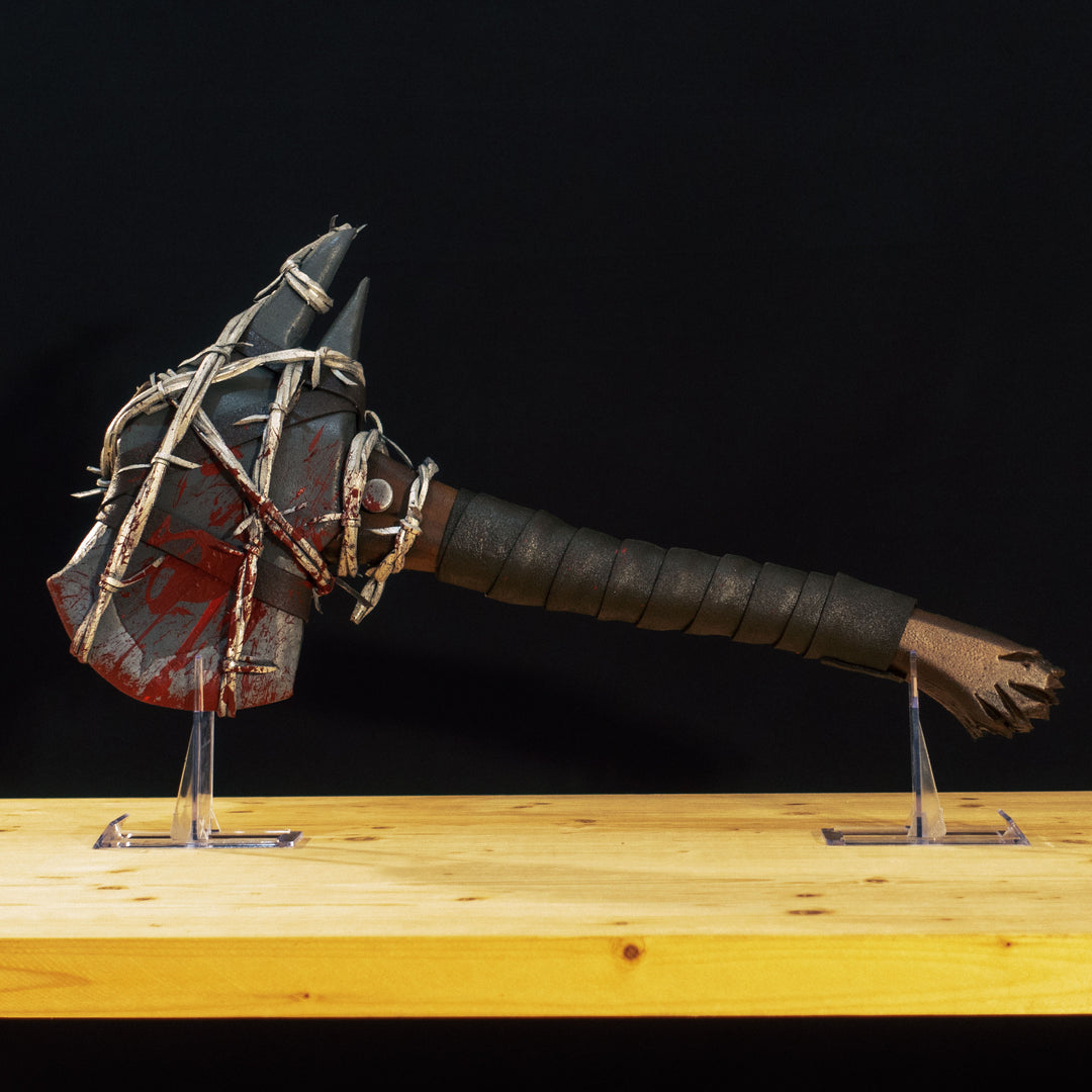 A TF2 Pyro Axtinguisher cosplay prop complete with fake barbed wires and blood splatters!