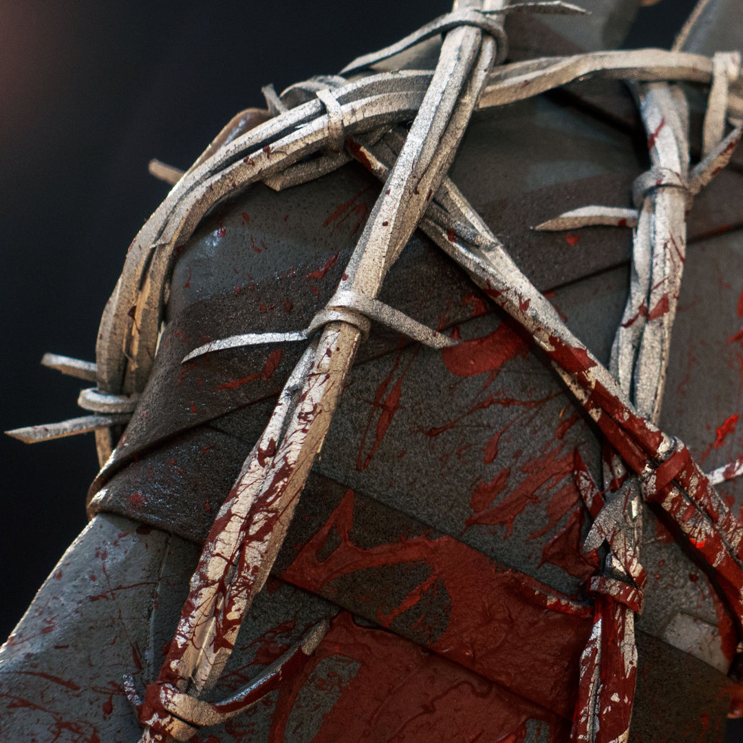 A TF2 Pyro Axtinguisher cosplay prop complete with fake barbed wires and blood splatters!