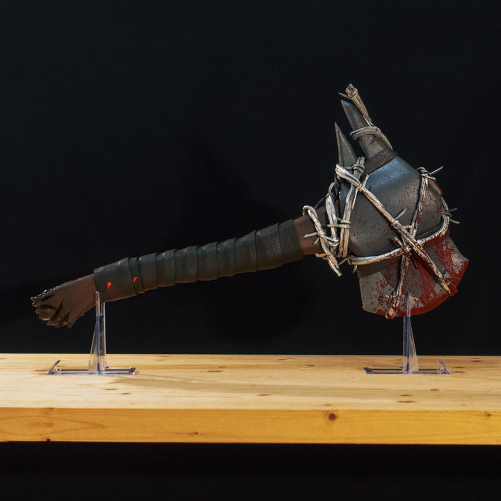 A TF2 Pyro Axtinguisher cosplay prop complete with fake barbed wires and blood splatters!