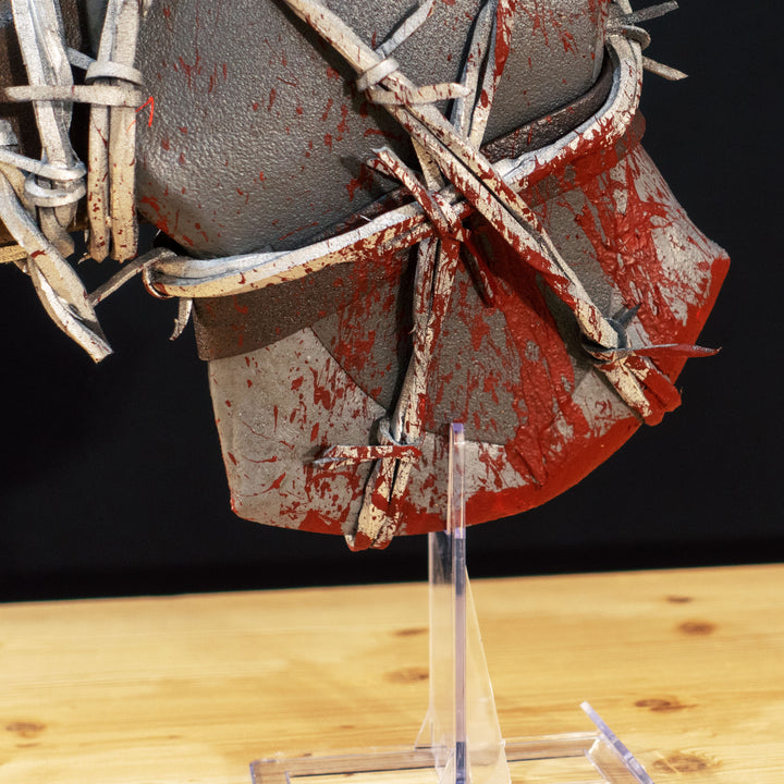 A TF2 Pyro Axtinguisher cosplay prop complete with fake barbed wires and blood splatters!