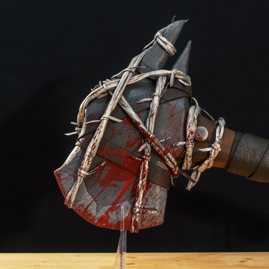 A TF2 Pyro Axtinguisher cosplay prop complete with fake barbed wires and blood splatters!