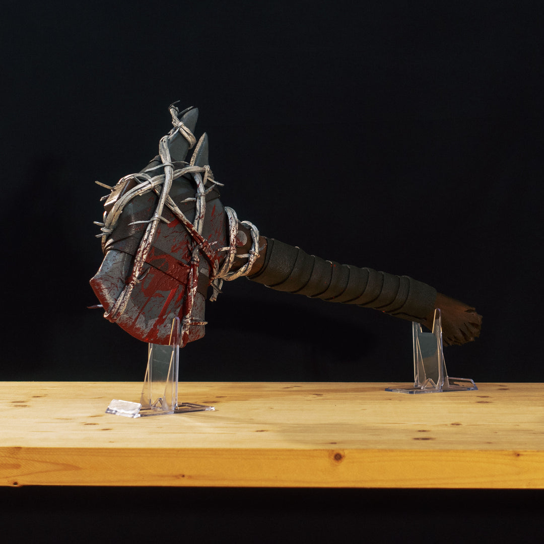 A TF2 Pyro Axtinguisher cosplay prop complete with fake barbed wires and blood splatters!