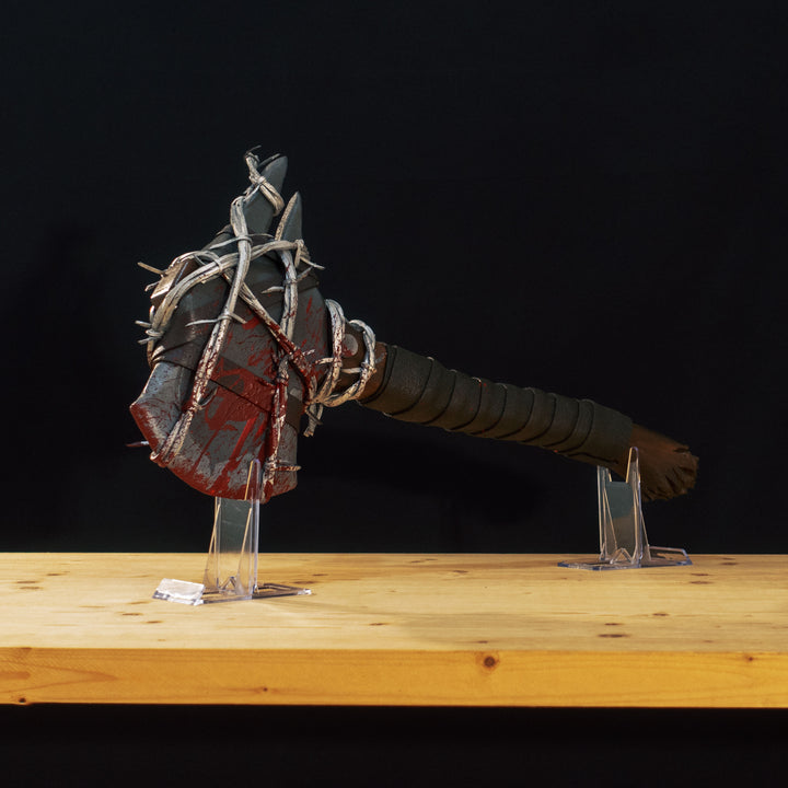 A TF2 Pyro Axtinguisher cosplay prop complete with fake barbed wires and blood splatters!
