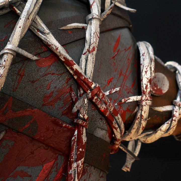 A TF2 Pyro Axtinguisher cosplay prop complete with fake barbed wires and blood splatters!
