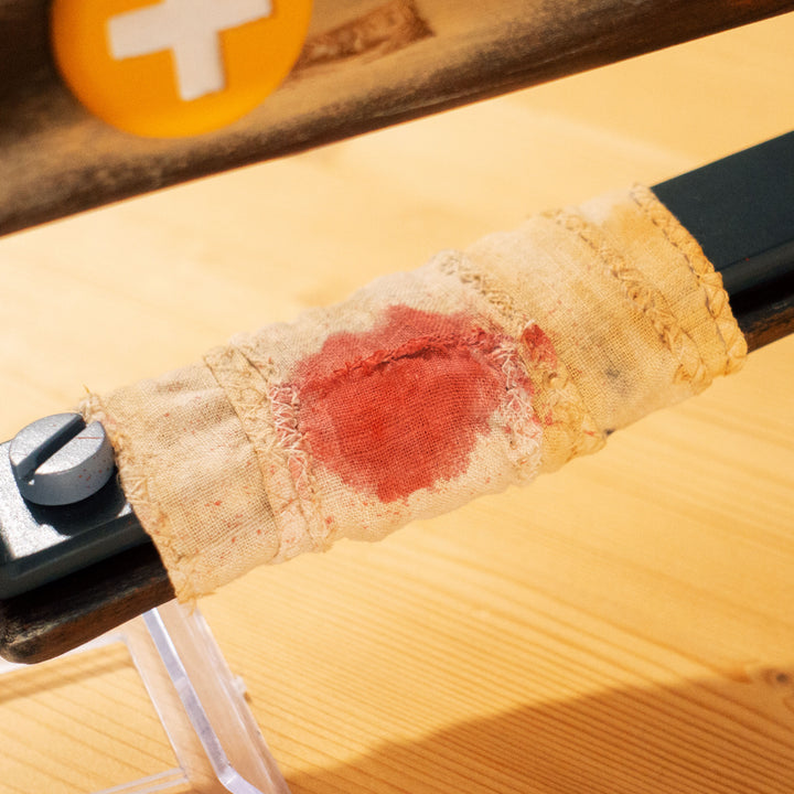 A TF2 Medic Crusader's Crossbow prop for cosplay or collection with a removable fake syringe bolt! Has all the little details from in-game like the bloody rag wrapped around the front wooden handle or small scuff all around.