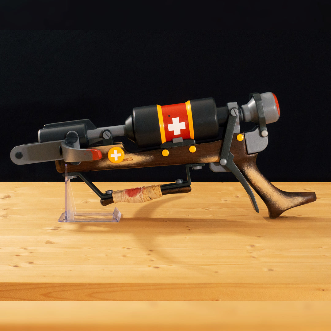 A TF2 Medic Crusader's Crossbow prop for cosplay or collection with a removable fake syringe bolt! Has all the little details from in-game like the bloody rag wrapped around the front wooden handle or small scuff all around.