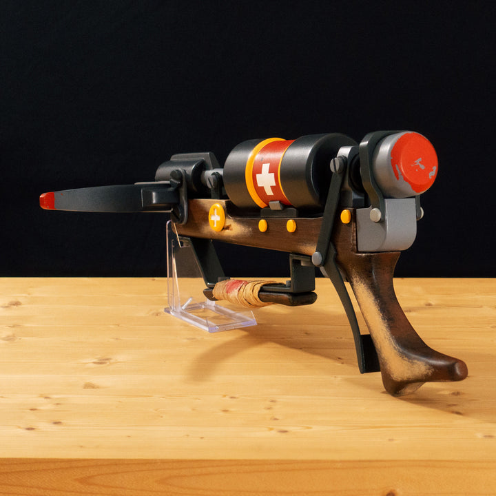 A TF2 Medic Crusader's Crossbow prop for cosplay or collection with a removable fake syringe bolt! Has all the little details from in-game like the bloody rag wrapped around the front wooden handle or small scuff all around.