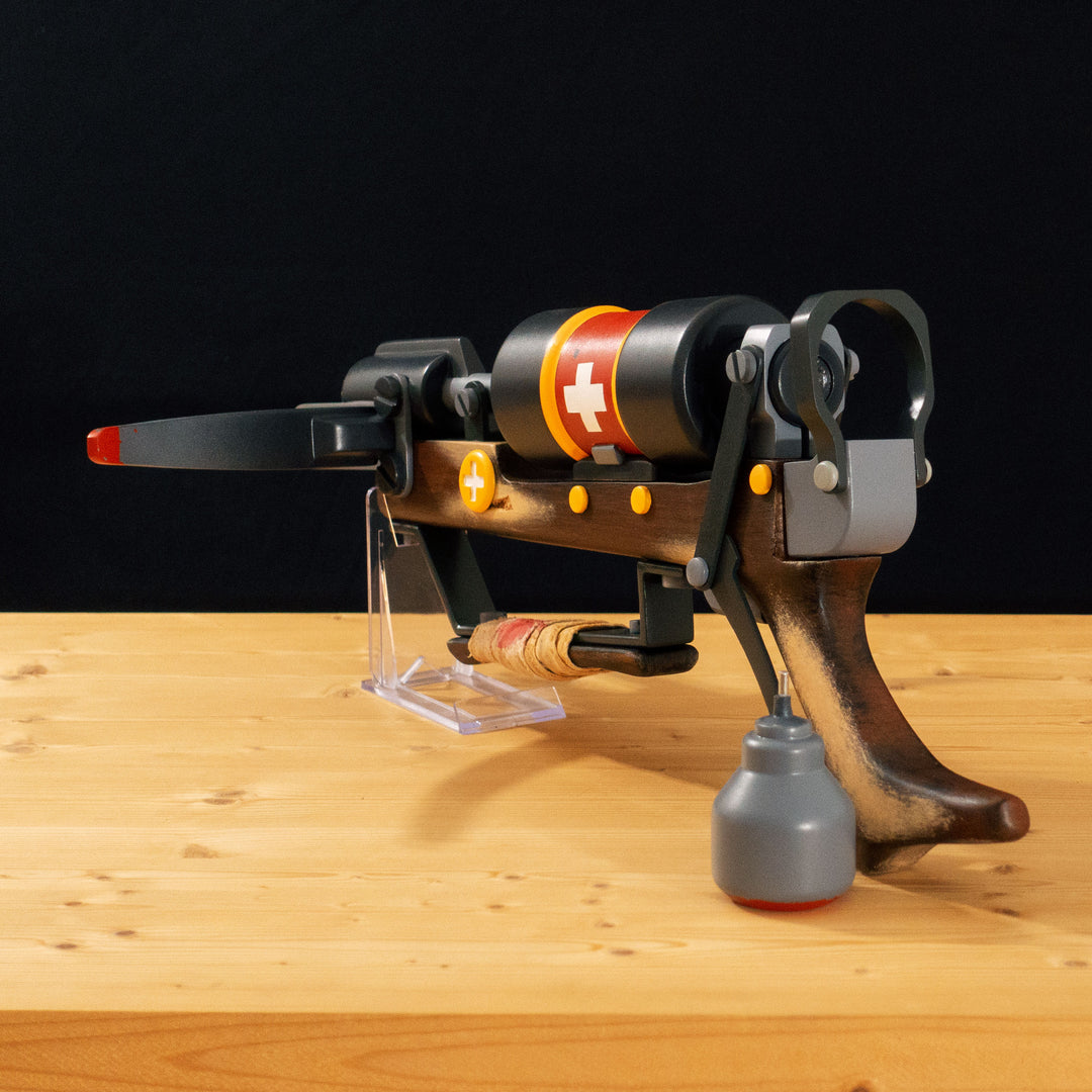 A TF2 Medic Crusader's Crossbow prop for cosplay or collection with a removable fake syringe bolt! Has all the little details from in-game like the bloody rag wrapped around the front wooden handle or small scuff all around.