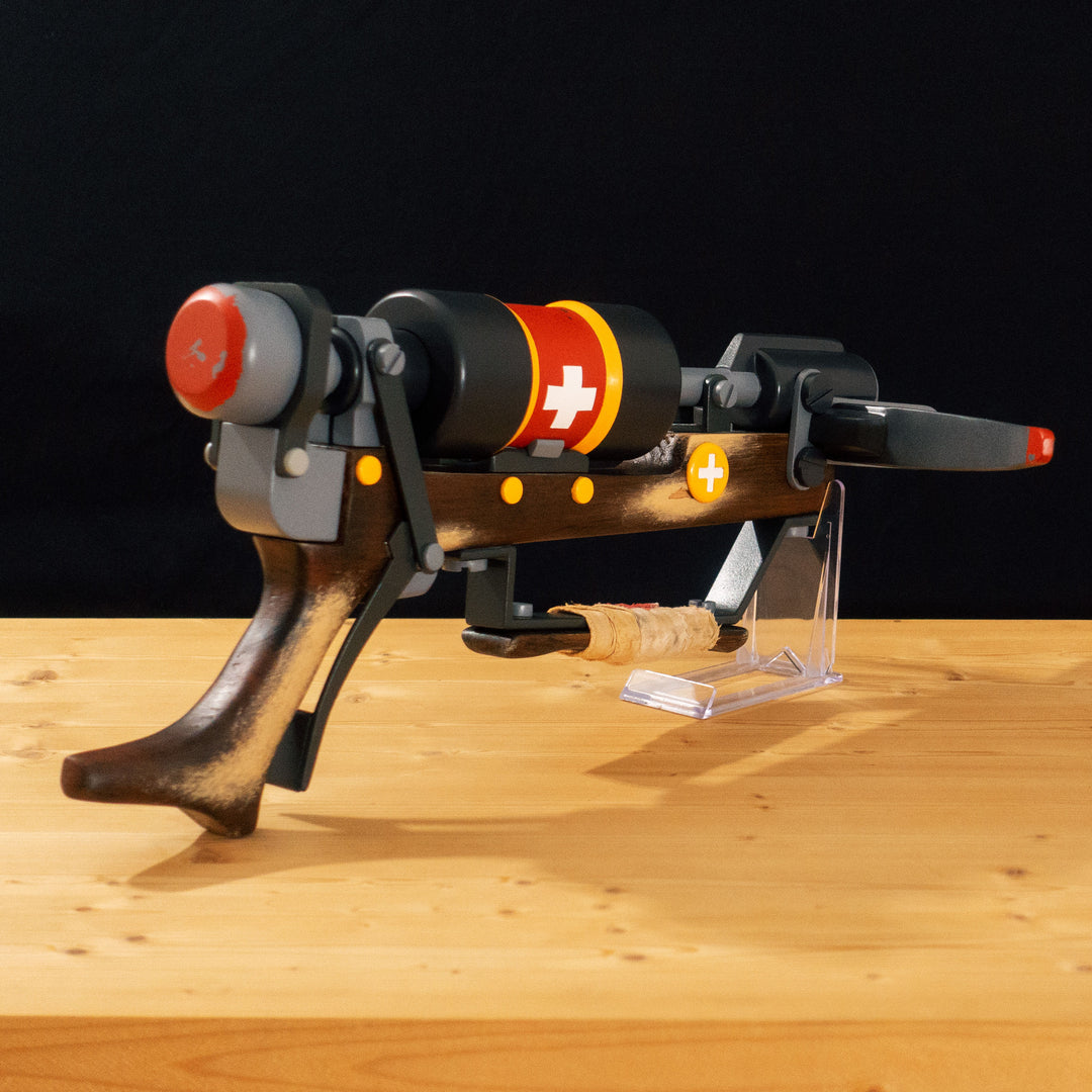 A TF2 Medic Crusader's Crossbow prop for cosplay or collection with a removable fake syringe bolt! Has all the little details from in-game like the bloody rag wrapped around the front wooden handle or small scuff all around.