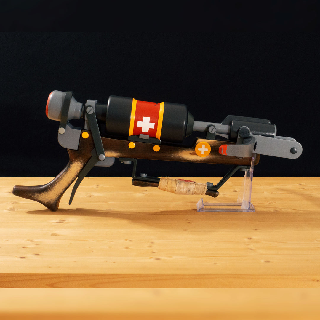 A TF2 Medic Crusader's Crossbow prop for cosplay or collection with a removable fake syringe bolt! Has all the little details from in-game like the bloody rag wrapped around the front wooden handle or small scuff all around.