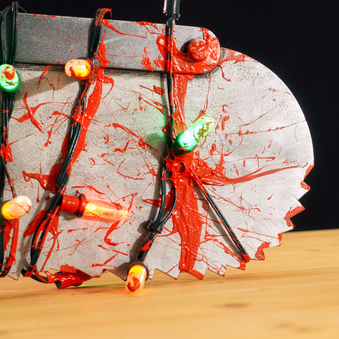 A TF2 Medic Bone Saw cosplay prop with a metal paint job! Comes in Festive and bloodied version!