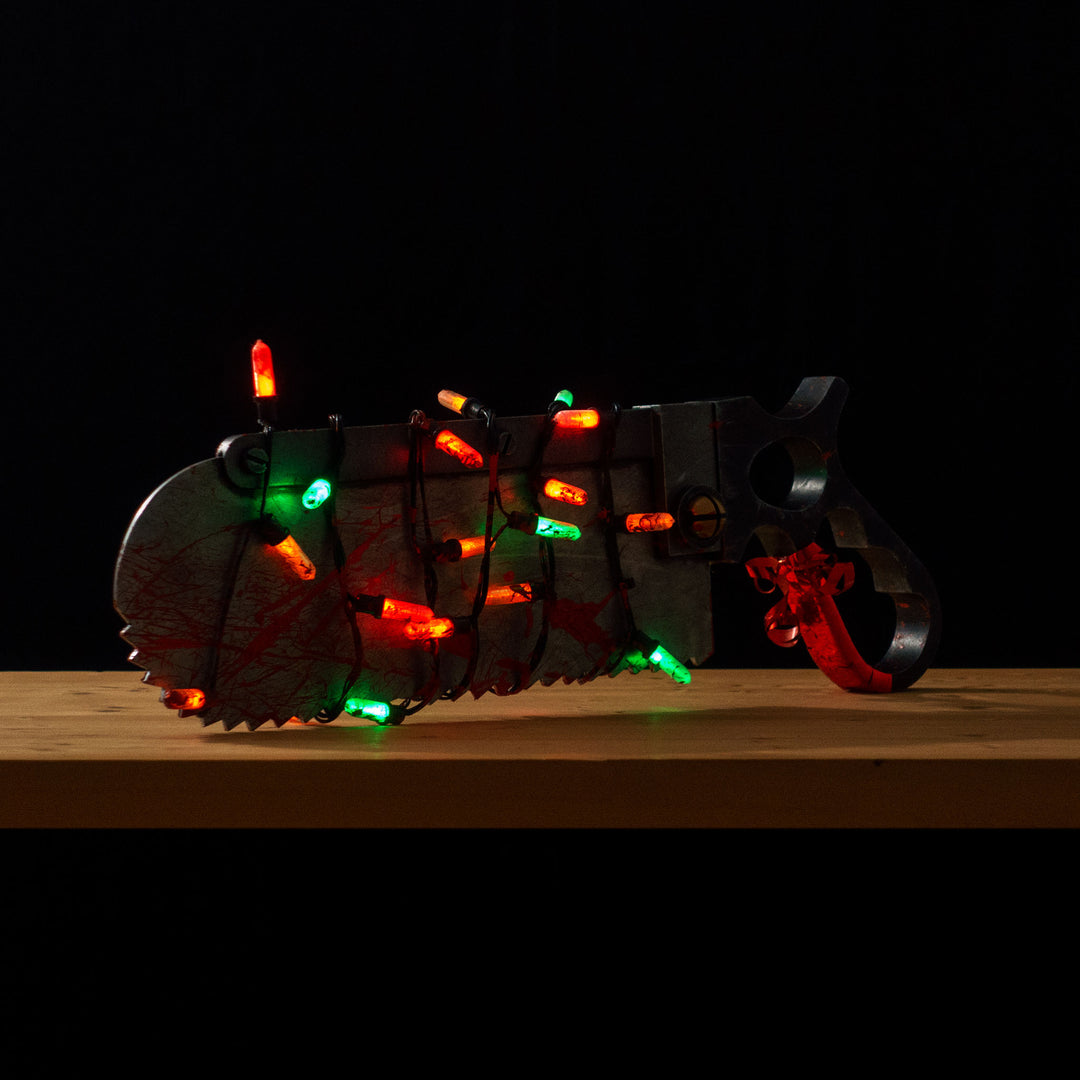 A TF2 Medic Bone Saw cosplay prop with a metal paint job! Comes in Festive and bloodied version!