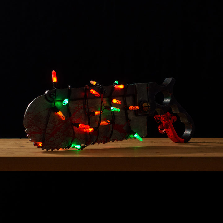 A TF2 Medic Bone Saw cosplay prop with a metal paint job! Comes in Festive and bloodied version!