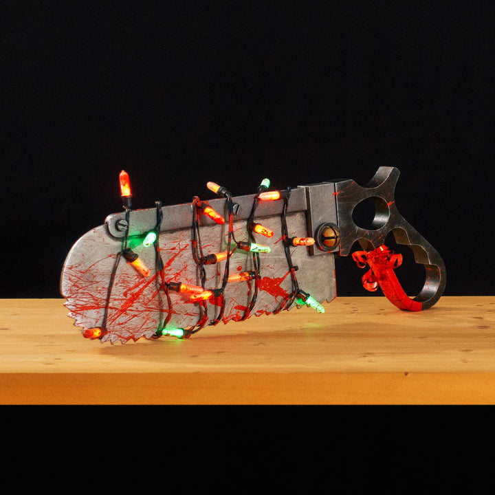 A TF2 Medic Bone Saw cosplay prop with a metal paint job! Comes in Festive and bloodied version!