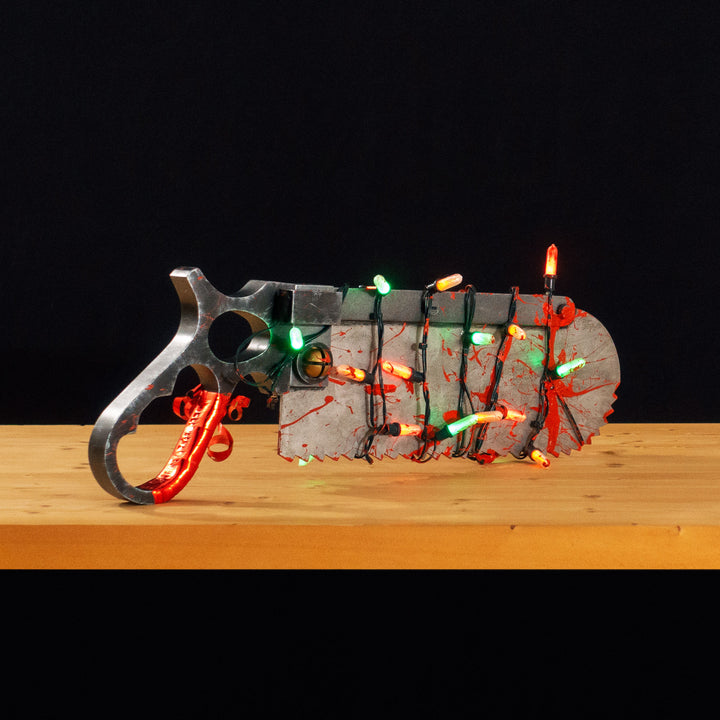 A TF2 Medic Bone Saw cosplay prop with a metal paint job! Comes in Festive and bloodied version!