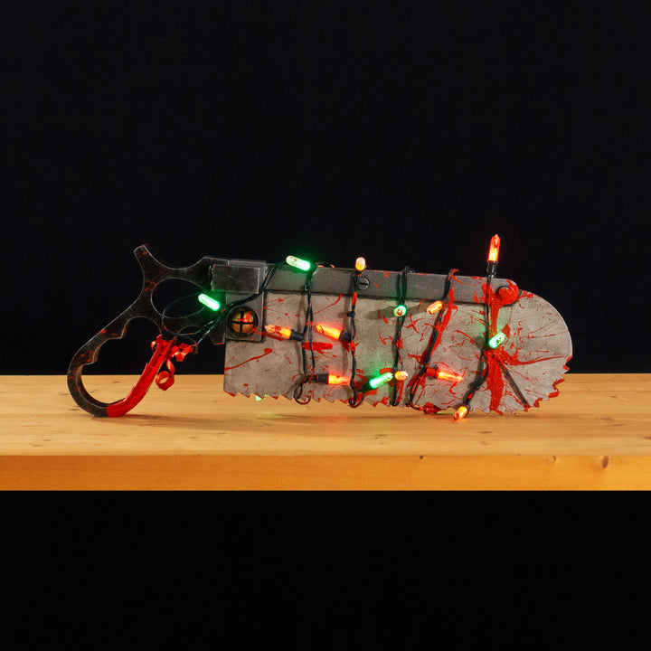 A TF2 Medic Bone Saw cosplay prop with a metal paint job! Comes in Festive and bloodied version!