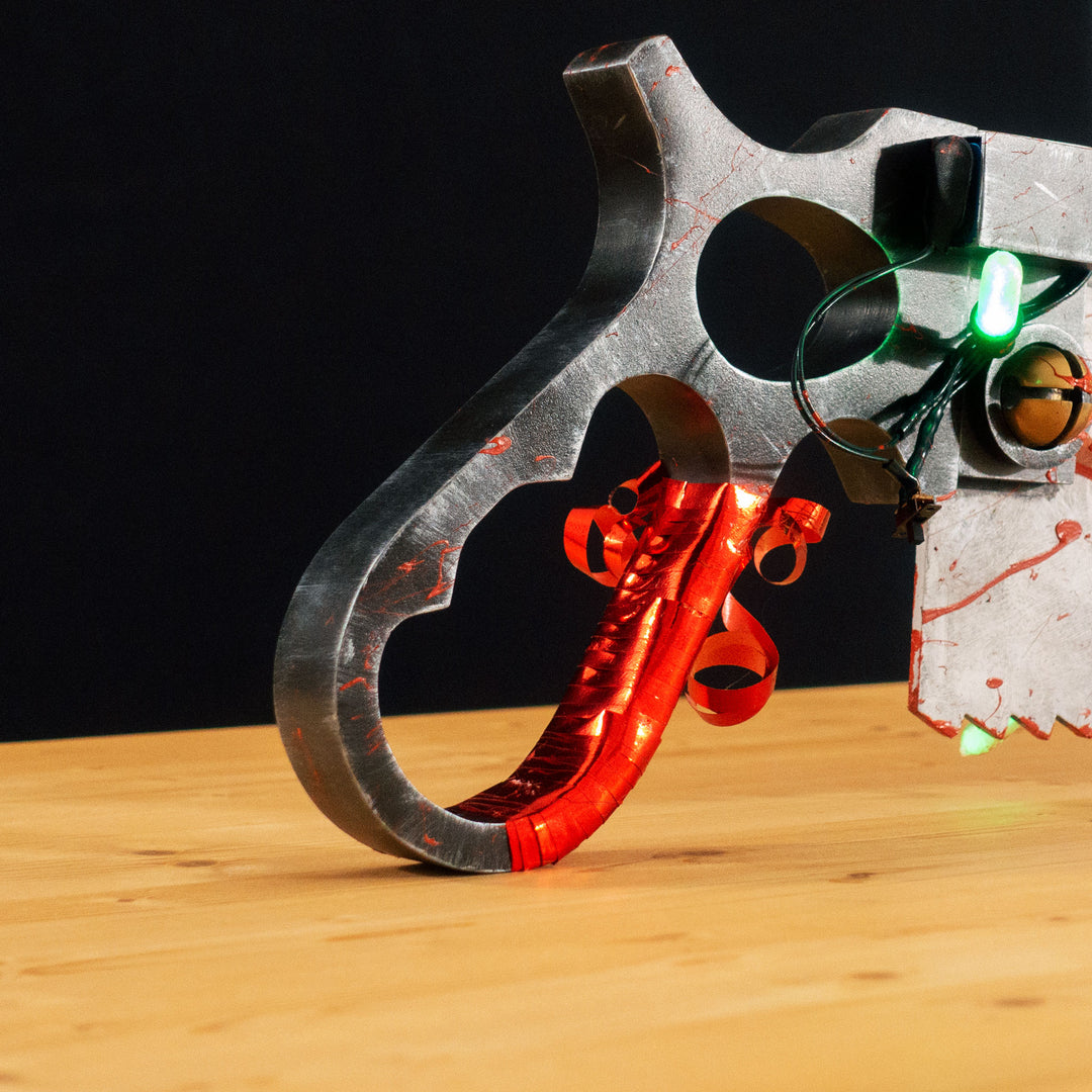 A TF2 Medic Bone Saw cosplay prop with a metal paint job! Comes in Festive and bloodied version!