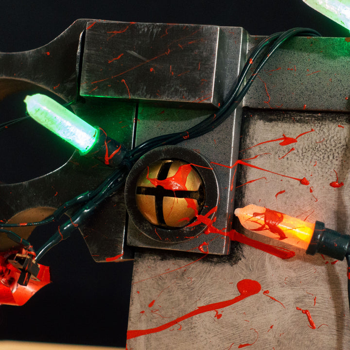 A TF2 Medic Bone Saw cosplay prop with a metal paint job! Comes in Festive and bloodied version!