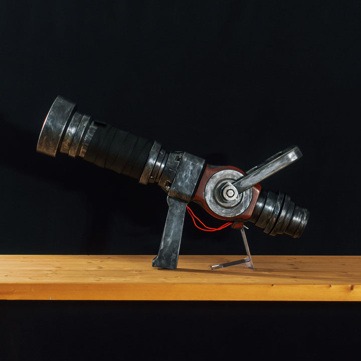 A TF2 Medic Medigun cosplay prop with a metal paint job that glows with 2 lights positions.