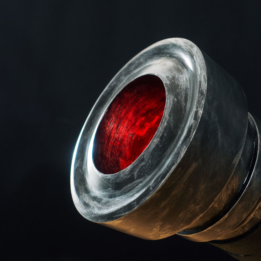 A TF2 Medic Medigun cosplay prop with a metal paint job that glows with 2 lights positions.