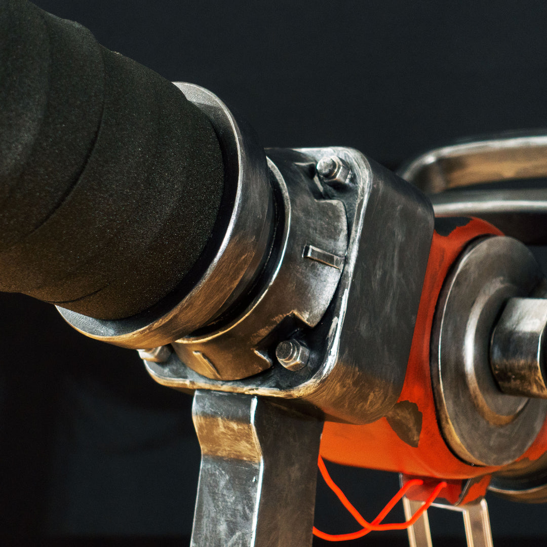 A TF2 Medic Medigun cosplay prop with a metal paint job that glows with 2 lights positions.