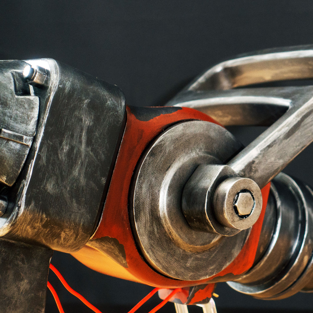 A TF2 Medic Medigun cosplay prop with a metal paint job that glows with 2 lights positions.