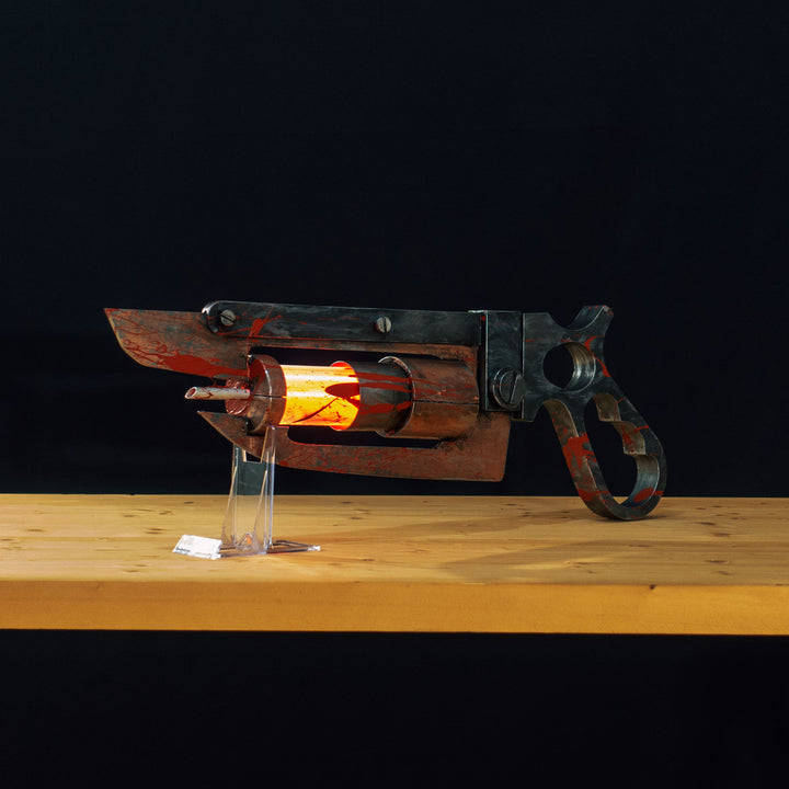 A TF2 Medic Übersaw prop with a metal paint job. Comes in Festive and with out without blood effects!