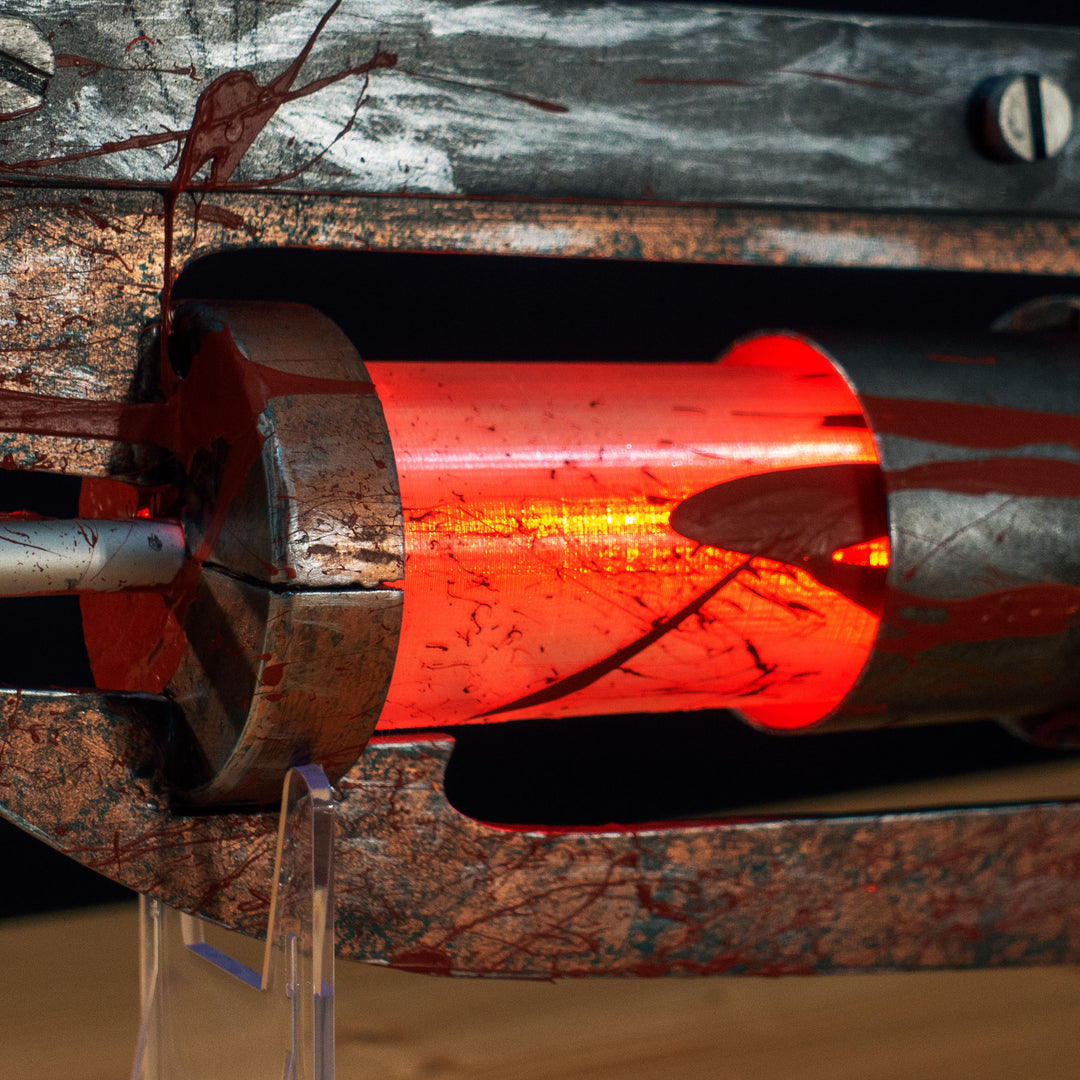 A TF2 Medic Übersaw prop with a metal paint job. Comes in Festive and with out without blood effects!