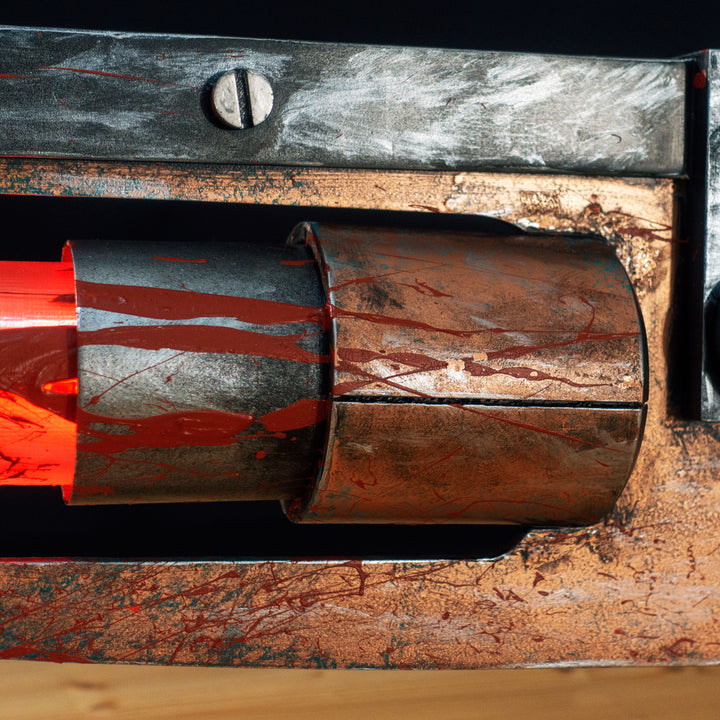 A TF2 Medic Übersaw prop with a metal paint job. Comes in Festive and with out without blood effects!