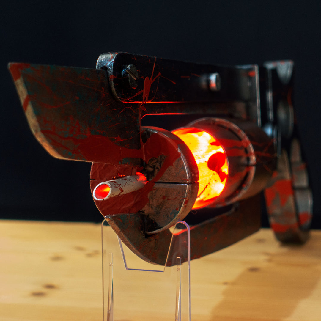 A TF2 Medic Übersaw prop with a metal paint job. Comes in Festive and with out without blood effects!