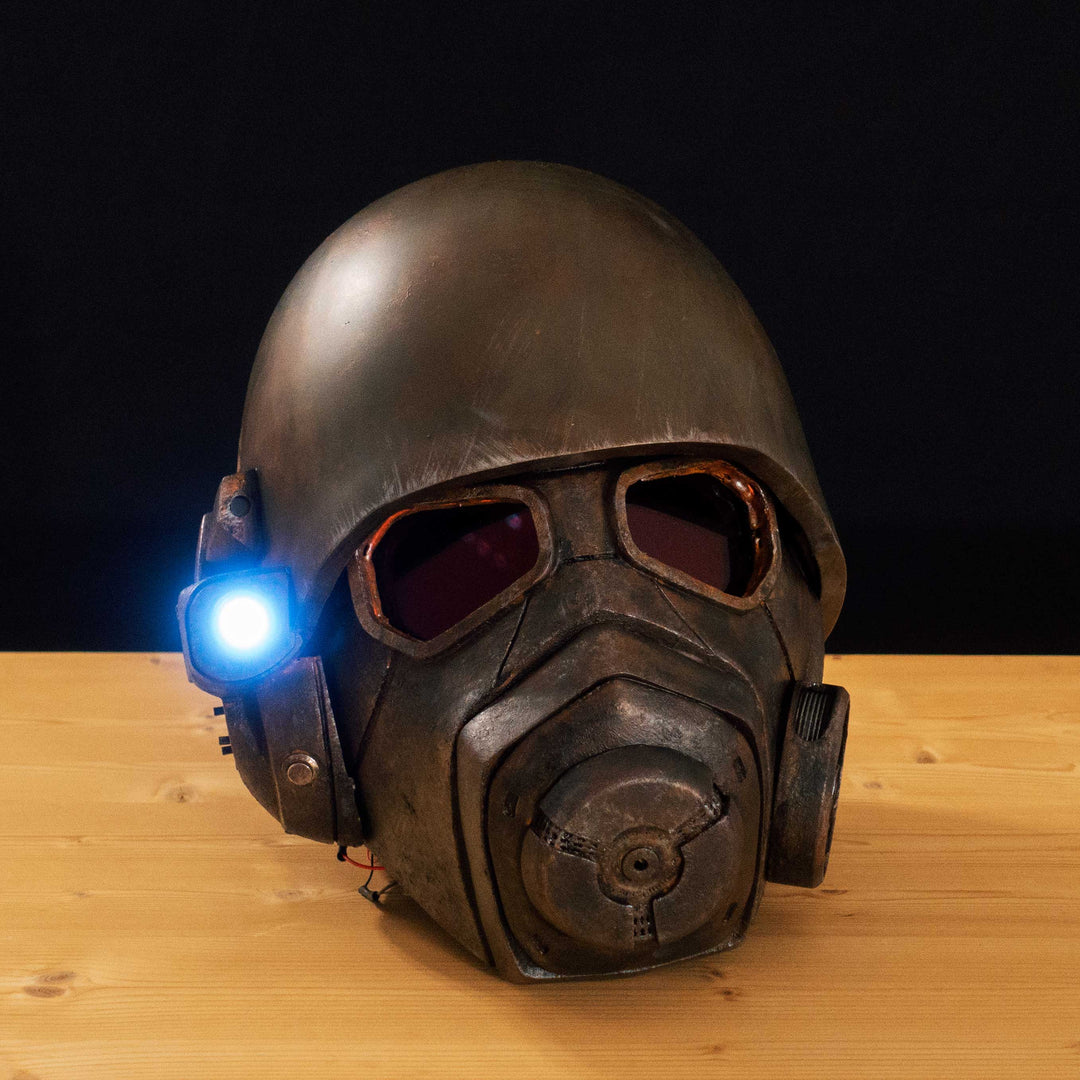 An Inspired Fallout New Vegas 2 parts helmet featuring the well knows NCR Ranger Helmet function. Lenses glow no matter the light, and it has side lights on the right side controlled at the right ear piece control panel. Has a fan inside to wick out moisture so you can be comfortable while wearing it for extended period of time. inside is padded with vegetable leather and a chin strap for align your vision with the lenses no matter your build.