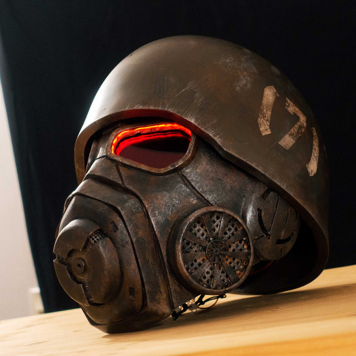 An Inspired Fallout New Vegas 2 parts helmet featuring the well knows NCR Ranger Helmet function. Lenses glow no matter the light, and it has side lights on the right side controlled at the right ear piece control panel. Has a fan inside to wick out moisture so you can be comfortable while wearing it for extended period of time. inside is padded with vegetable leather and a chin strap for align your vision with the lenses no matter your build.