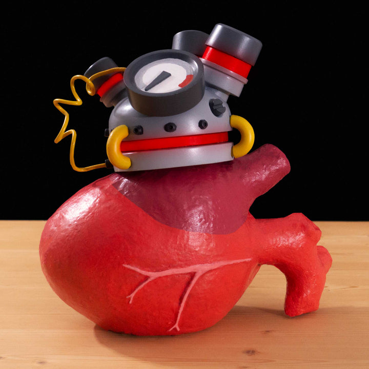 A tf2 Über Apparatus cosplay prop featured in meet the real medic with options for team color and electronics plus an oversized Megababoon heart!