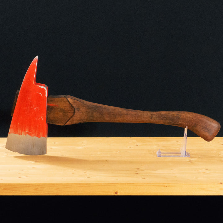 A TF2 Pyro Fire Axe cosplay prop with a Metal paint job