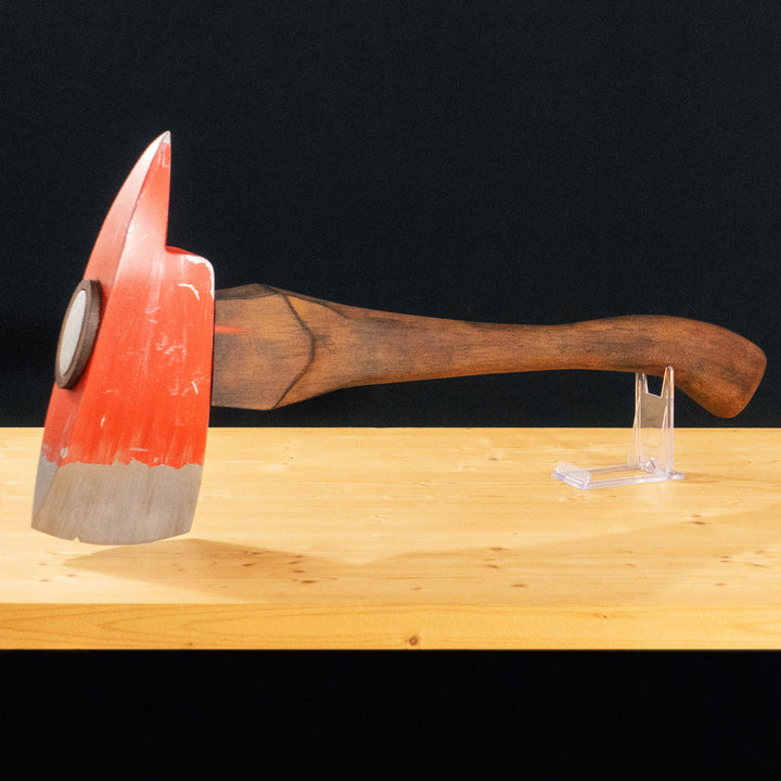 A TF2 Pyro Fire Axe cosplay prop with a Metal paint job