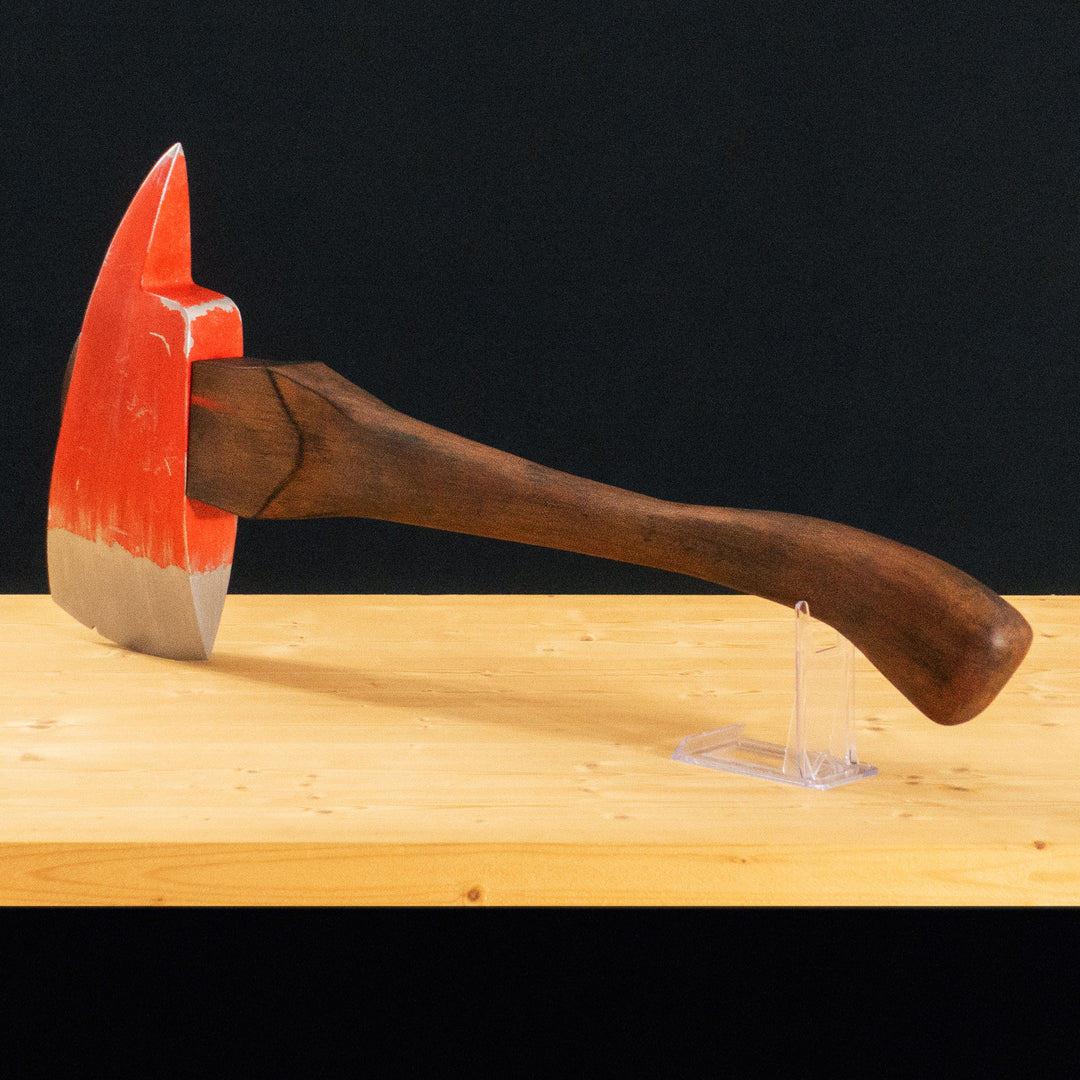 A TF2 Pyro Fire Axe cosplay prop with a Metal paint job